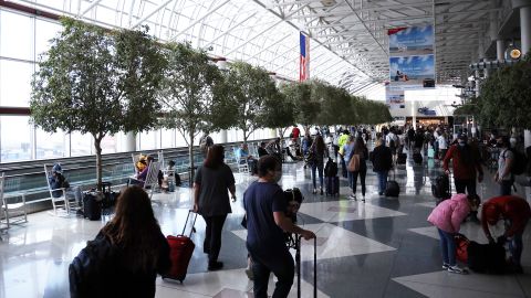 Passengers walk between terminals at Charlotte Douglas International Airport on May 15, 2020 in Charlotte, North Carolina. 