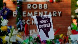 A banner hangs at a memorial outside Robb Elementary School to honor the victims killed in last week's school shooting, Friday, June 3, 2022, in Uvalde, Texas. (AP Photo/Eric Gay)