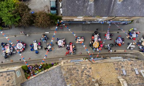People gather for a street party in Hayfield, England, on Saturday.
