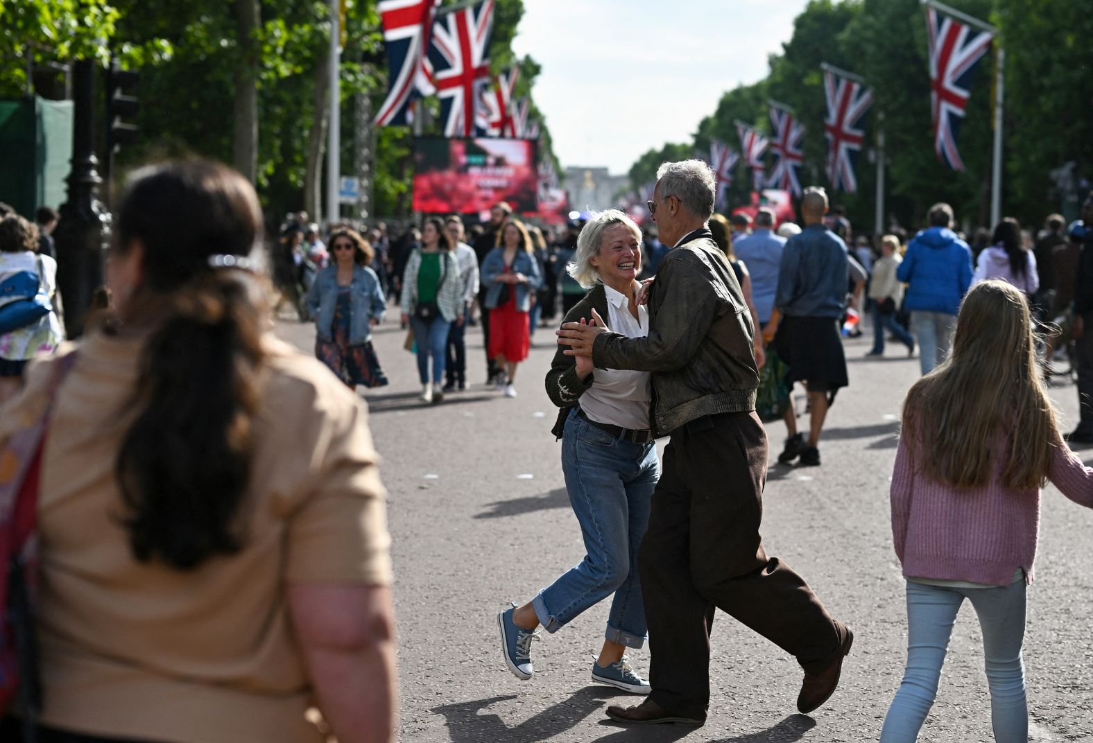 People dance during jubilee celebrations in London on Saturday. 