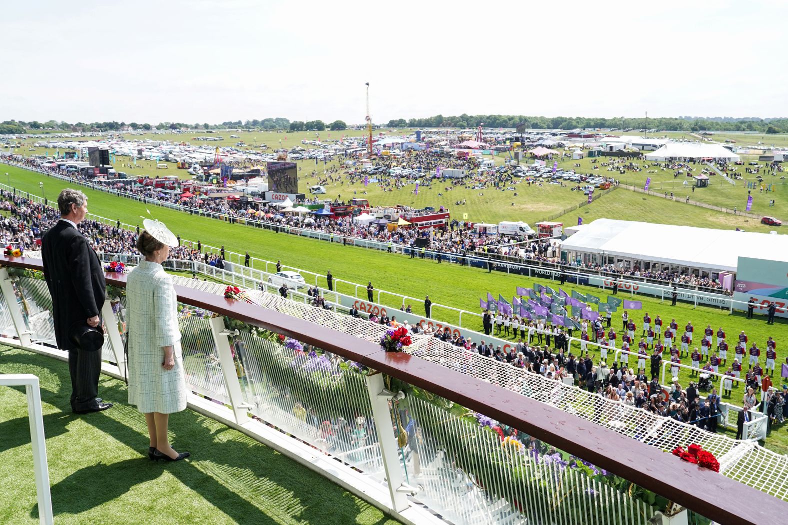 Princess Anne, the Queen's only daughter, stands on the balcony of the royal box while attending the Epsom Derby horse race on Saturday. She was filling in for her mother, who has been a regular spectator at the event in past years.