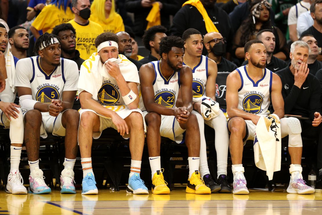 Warriors players look on from the bench in the fourth quarter against the Celtics. 