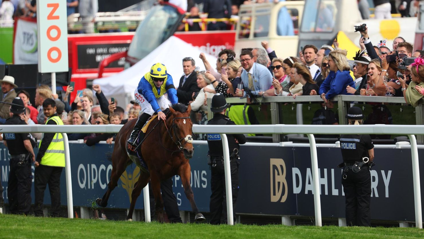 Richard Kingscote rides Desert Crown to victory in the Epsom Derby.