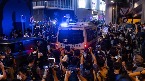 A police van carrying a protester  near Hong Kong's Victoria Park on June 4.