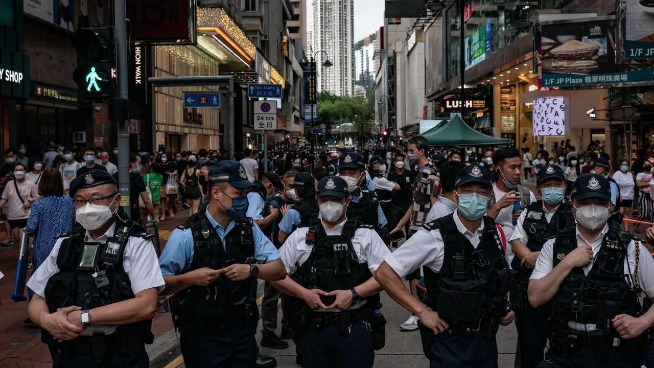 Police officers near Victoria Park, the traditional site of the annual Tiananmen candlelight vigil, on June 4 in Hong Kong.