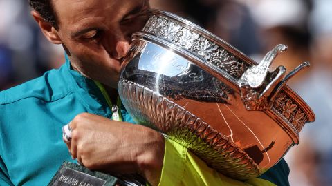 Spain's Rafael Nadal celebrates with the trophy after winning against Norway's Casper Ruud at the end of their men's singles final match on day fifteen of the Roland-Garros Open tennis tournament at the Court Philippe-Chatrier in Paris on June 5, 2022. 