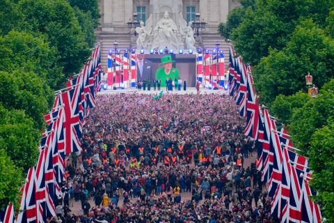 Crowds watch the Queen's appearance in London on Sunday. 