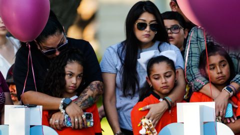 Mourners pay their respects at a memorial for the children and teachers killed at Robb Elementary School in Uvalde, Texas, last month.