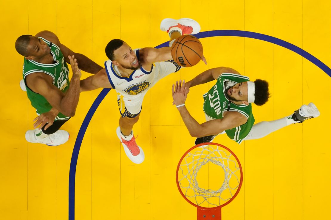 Curry shoots during the first half against the Celtics.