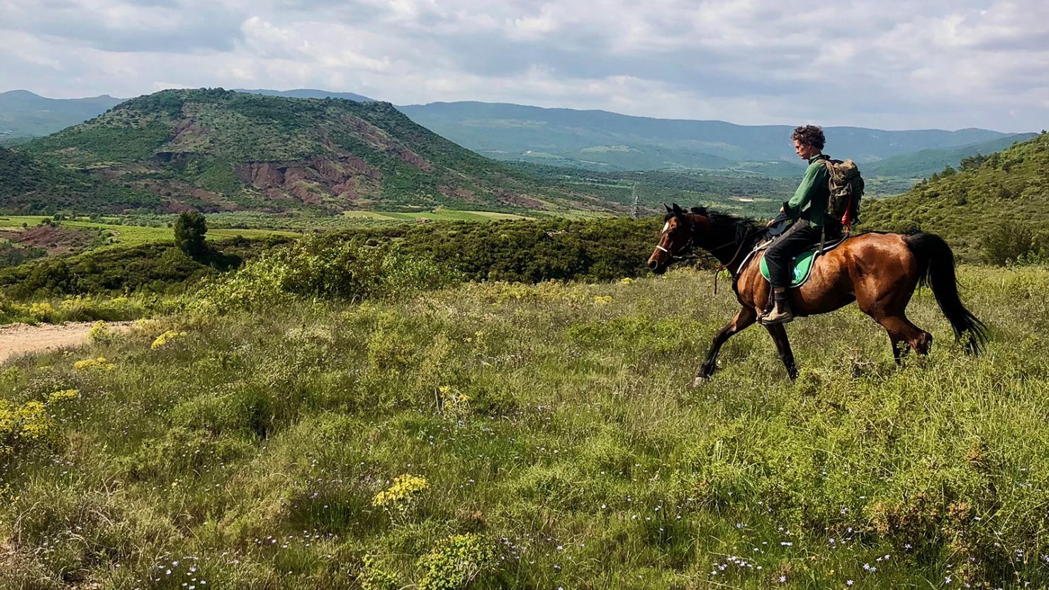 Louis Hall is riding from Italy to Spain on horseback.