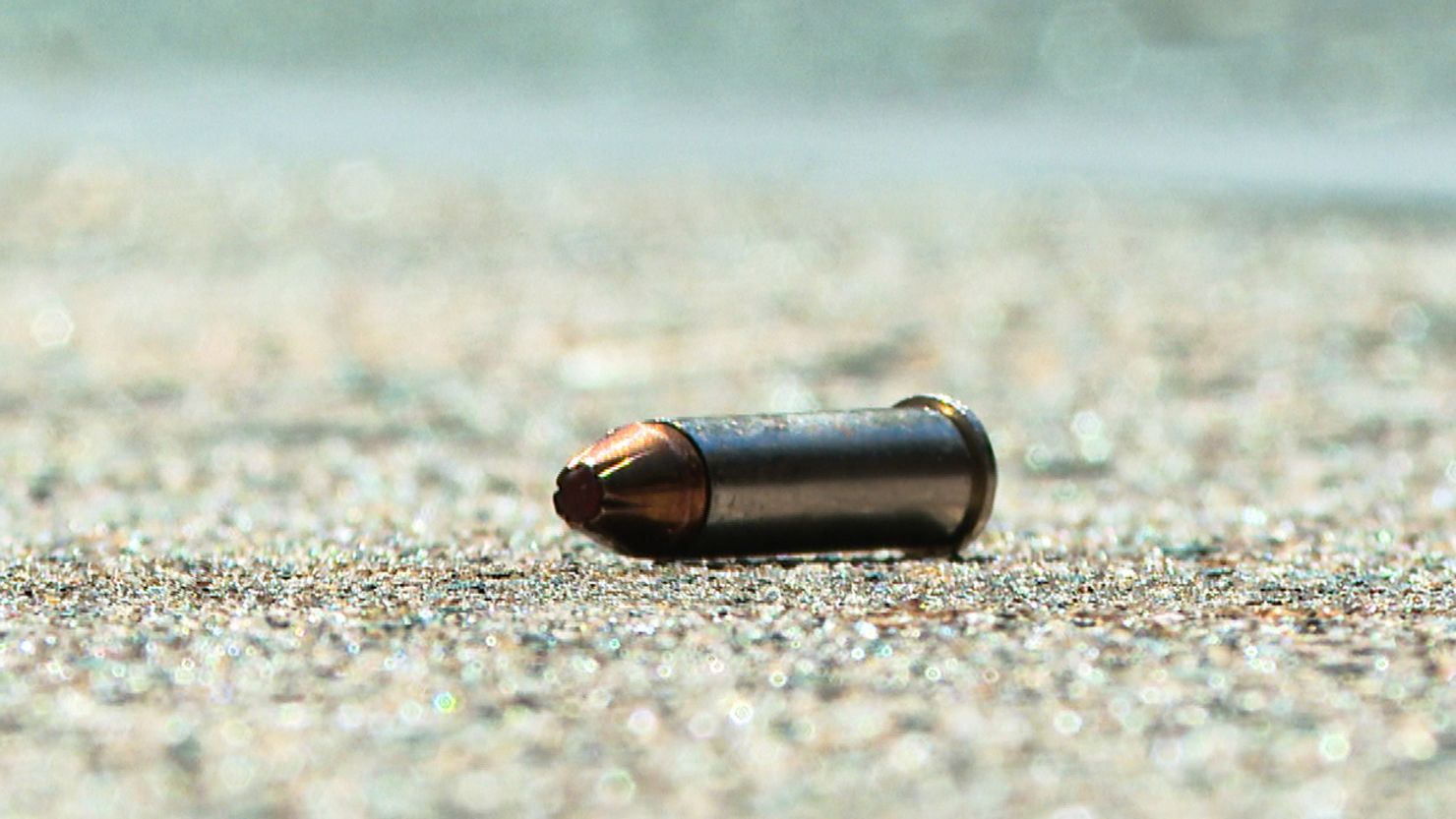 A bullet casing is seen at the crime scene after at least three people were killed and 11 injured in a shooting in the busy South Street area of Philadelphia on Sunday, June 5, 2022.