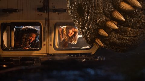 (from left) Kayla Watts (DeWanda Wise), Dr. Ellie Sattler (Laura Dern) and a Giganotosaurus in Jurassic World Dominion, co-written and directed by Colin Trevorrow.