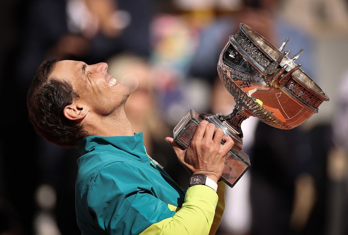 Nadal holds aloft La Coupe des Mousquetaires (The Musketeers' Trophy) at Roland Garros. 