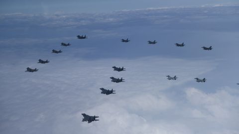 Twenty fighter jets, including South Korean F-35As, F-15Ks and KF-16s  and US F-16 jets, take part in an aerial show of force to North Korea on Tuesday morning.