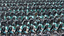 SHENYANG, CHINA - APRIL 18: Shared electric bicycles of Qingju, the bike-sharing unit of Chinese ride-hailing giant Didi Chuxing, are seen at a parking lot on April 18, 2022 in Shenyang, Liaoning Province of China. (Photo by VCG/VCG via Getty Images)
