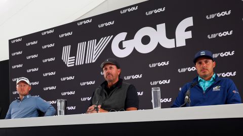 Mickelson speaks in a press conference, seated alongside Justin Harding and Chase Koepka.