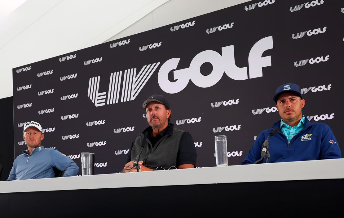 Mickelson speaks in a press conference, seated alongside Justin Harding and Chase Koepka.
