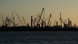 SABINE PASS, TX - APRIL 14: Construction cranes stand silhouetted by the sunset at the Golden Pass LNG Terminal in Sabine Pass, TX, on Thursday, April 14, 2022. 

Golden Pass LNG, a joint venture between ExxonMobil and Qatar Petroleum, began as an import terminal and construction seen today will create export capability.