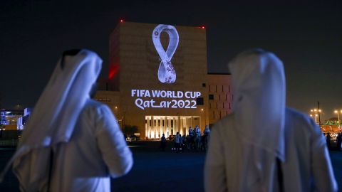 Qataris gather at the capital Doha's traditional Souq Waqif market as the official logo of the FIFA World Cup Qatar 2022 is projected on the front of a building on September 3, 2019. 