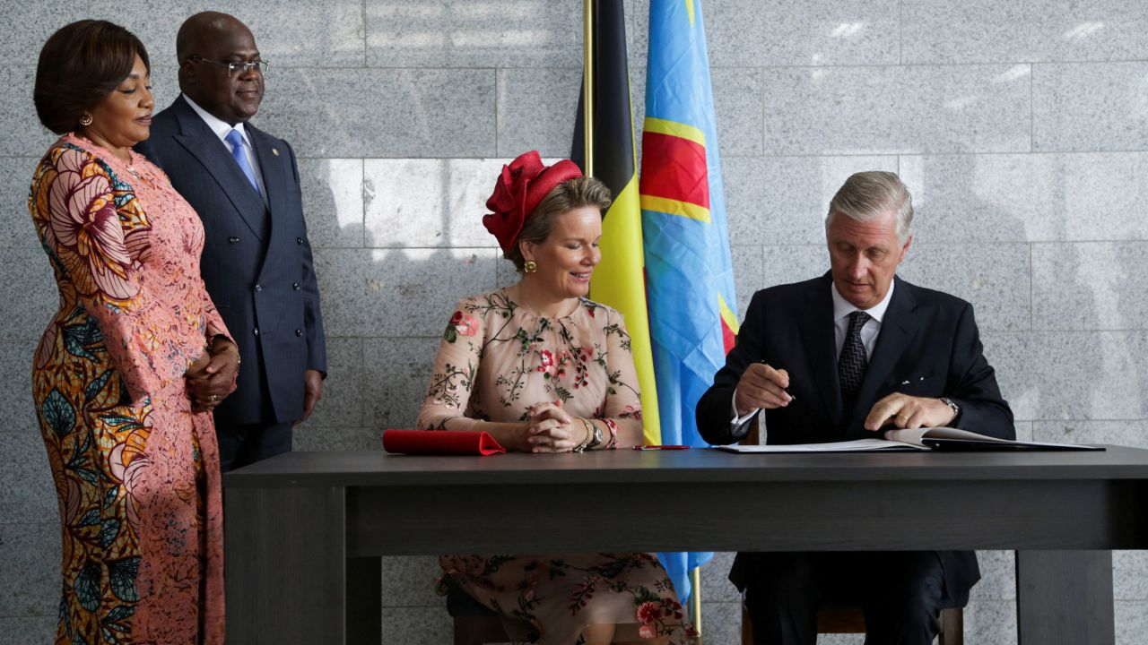 Democratic Republic of Congo President Felix Tshisekedi (second left) and his wife Denise Nyakeru Tshisekedi (far left) look on as Belgium's King Philippe (far right) and Queen Mathilde (second right) sign a guest book on June 8.
