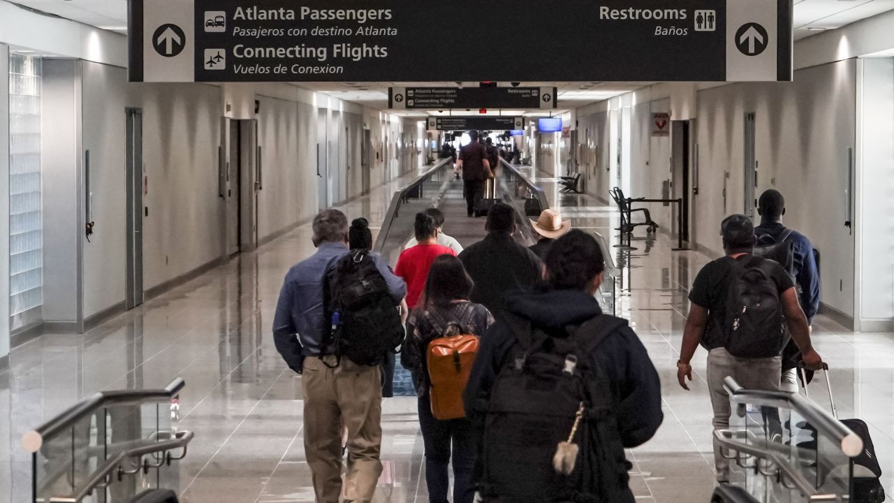 Travelers walk into US customs at Hartsfield-Jackson International Airport in Atlanta.