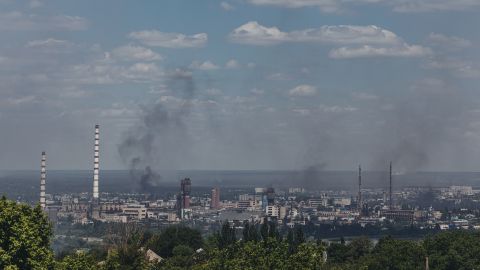 Smoke rises from the city of Severodonetsk seen from Lysychansk, in Ukraine's Luhansk region, on June 8, 2022.
