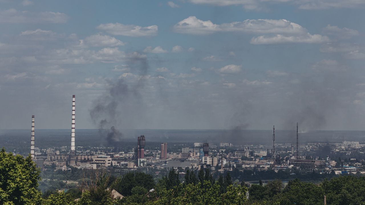 Smoke rises from the city of Severodonetsk seen from Lysychansk, in Ukraine's Luhansk region, on June 8, 2022.