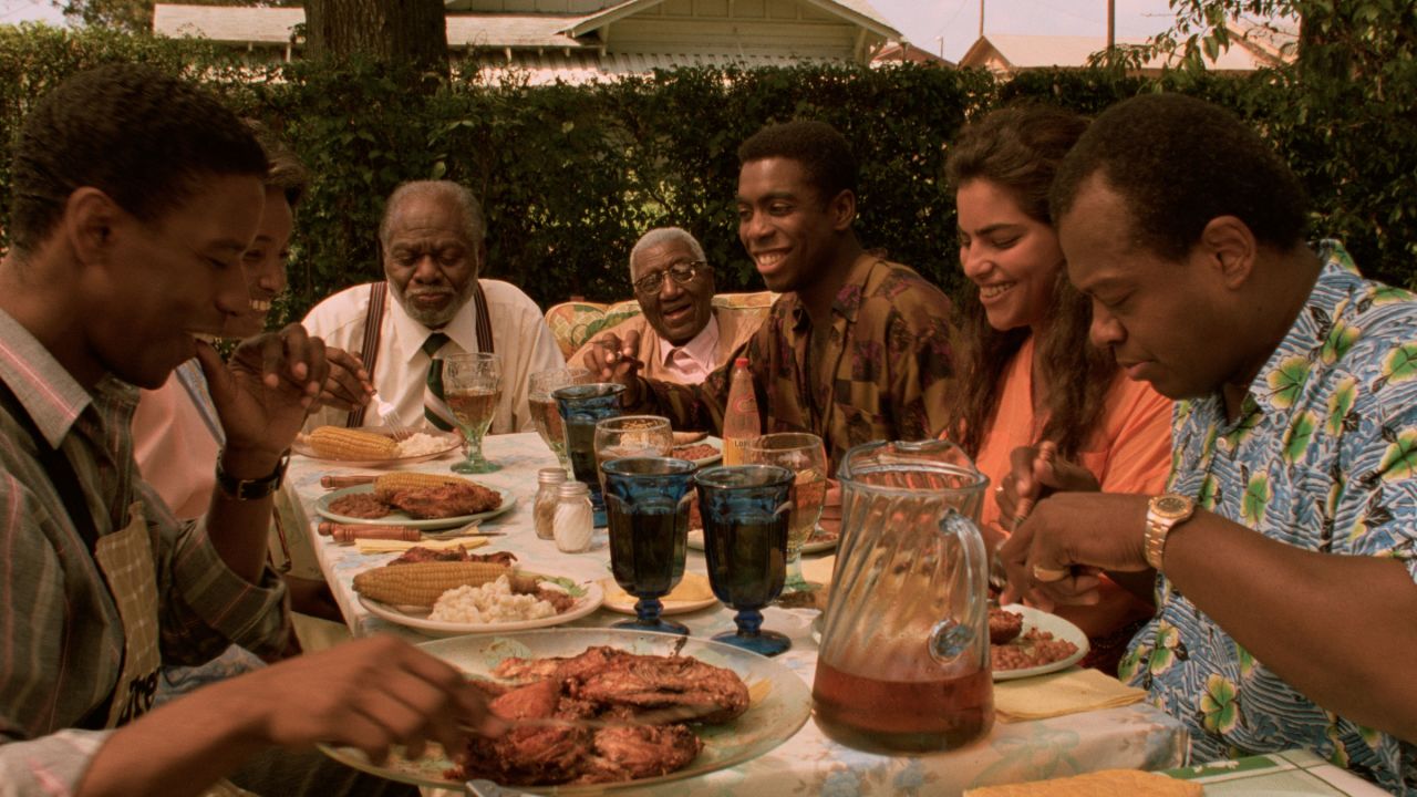 A scene from "Mississippi Masala" shows the family sharing a meal together. 