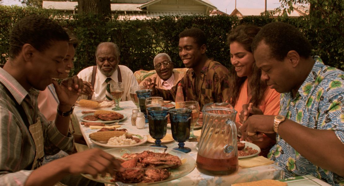 A scene from "Mississippi Masala" shows the family sharing a meal together. 