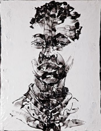 Buthelezi developed his own method of melting the plastic refuse with a heat gun and applying it to a canvas as you would a thick paint. Pictured: "Portrait of a Boy."