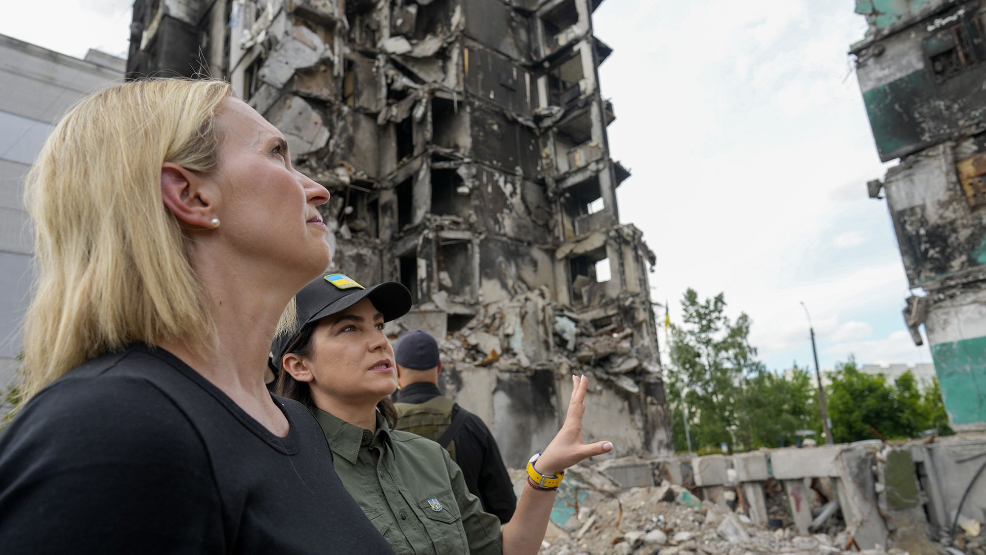 U.S. ambassador to Ukraine Bridget Brink, left, listens to Ukraine's Prosecutor General Iryna Venediktov during a tour of Borodyanka, Ukraine, on June 4.