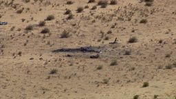Personnel arrive near the scene where a US Marine MV-22B Osprey crashed near Glamis, California, on June 8.