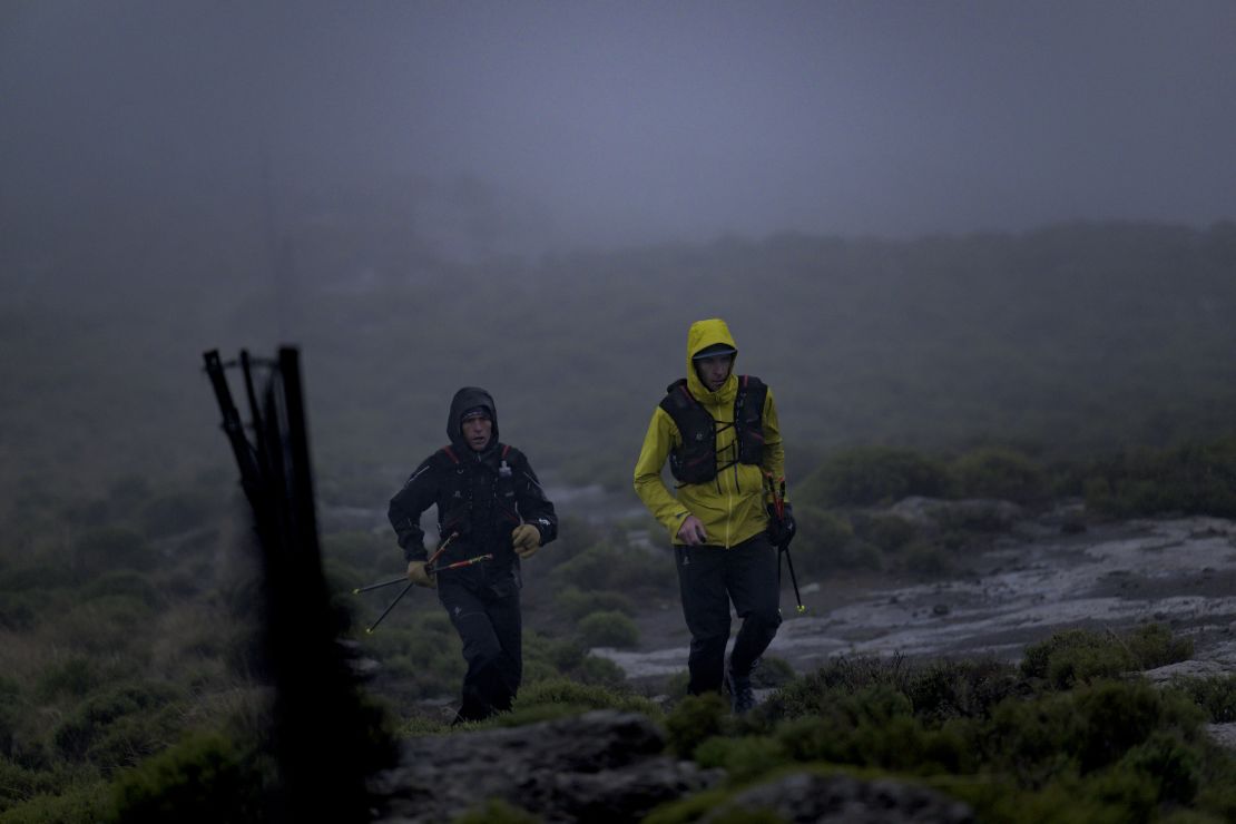 Griesel and Sandes making a big push up one of Lesotho's many mountains during a particularly rainy day.