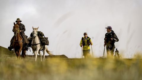 A crew on horseback support Sandes and Griesel during a leg of their Lesotho circumnavigation run.