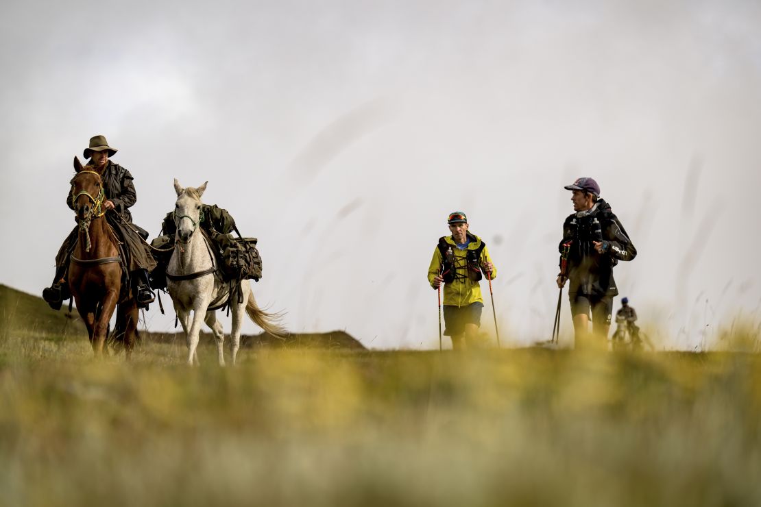 A crew on horseback support Sandes and Griesel during a leg of their Lesotho circumnavigation run.