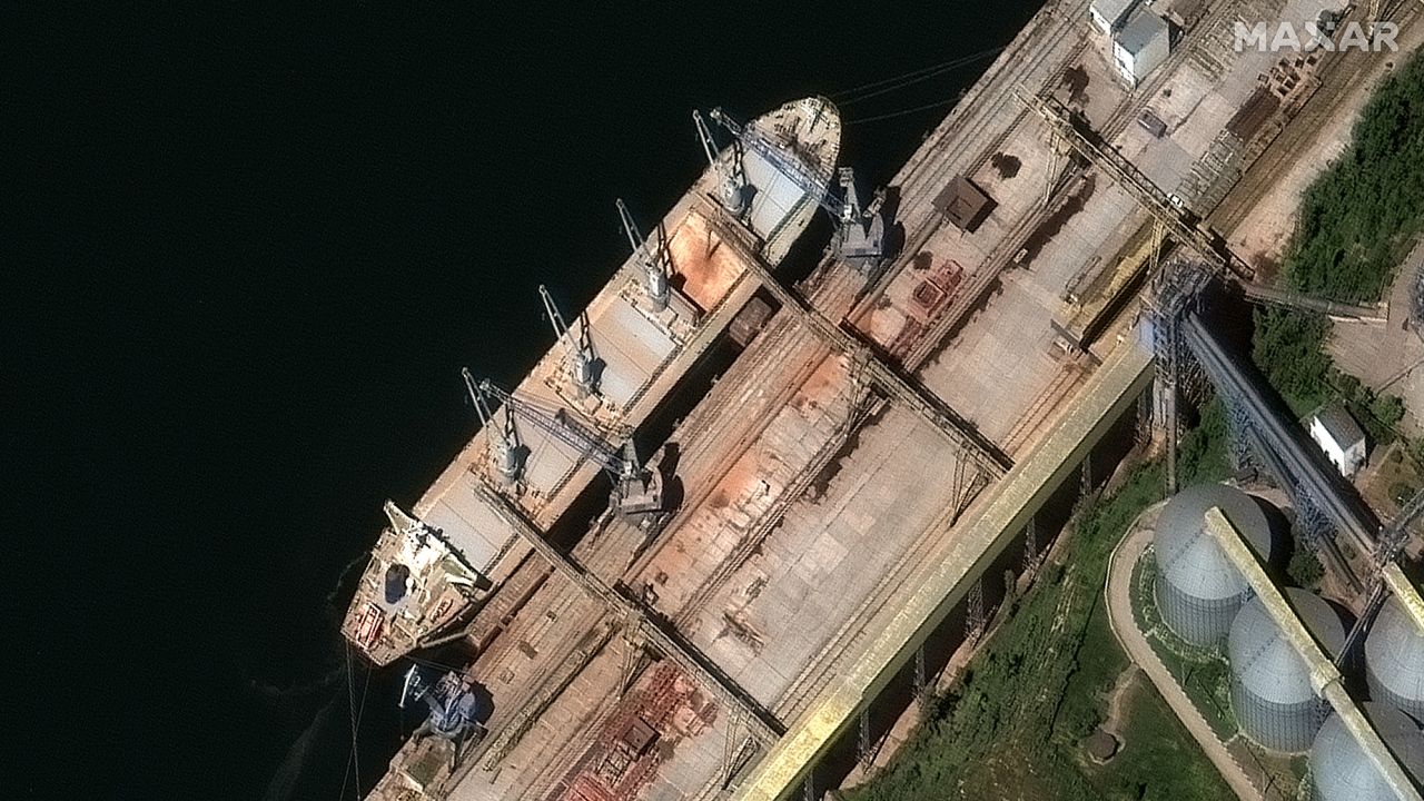 A satellite image from Maxar Technologies shows grain being loaded into the hull of the Russia-flagged ship Matros Pozynich in Crimea.