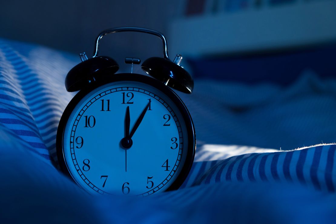 Checking your clock when you wake up early can trigger stress and make it hard to go back to sleep, experts say.