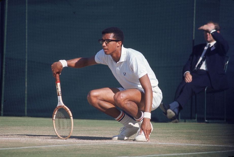 Ashe plays at Wimbledon in 1964. A year earlier, he won the NCAA title at UCLA and became the first African American to represent the United States in the Davis Cup.