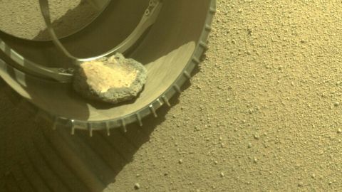 The Mars Perseverance rover gained a new traveling companion when a rock hopped into its wheel four months ago while it explored Jezero Crater. 