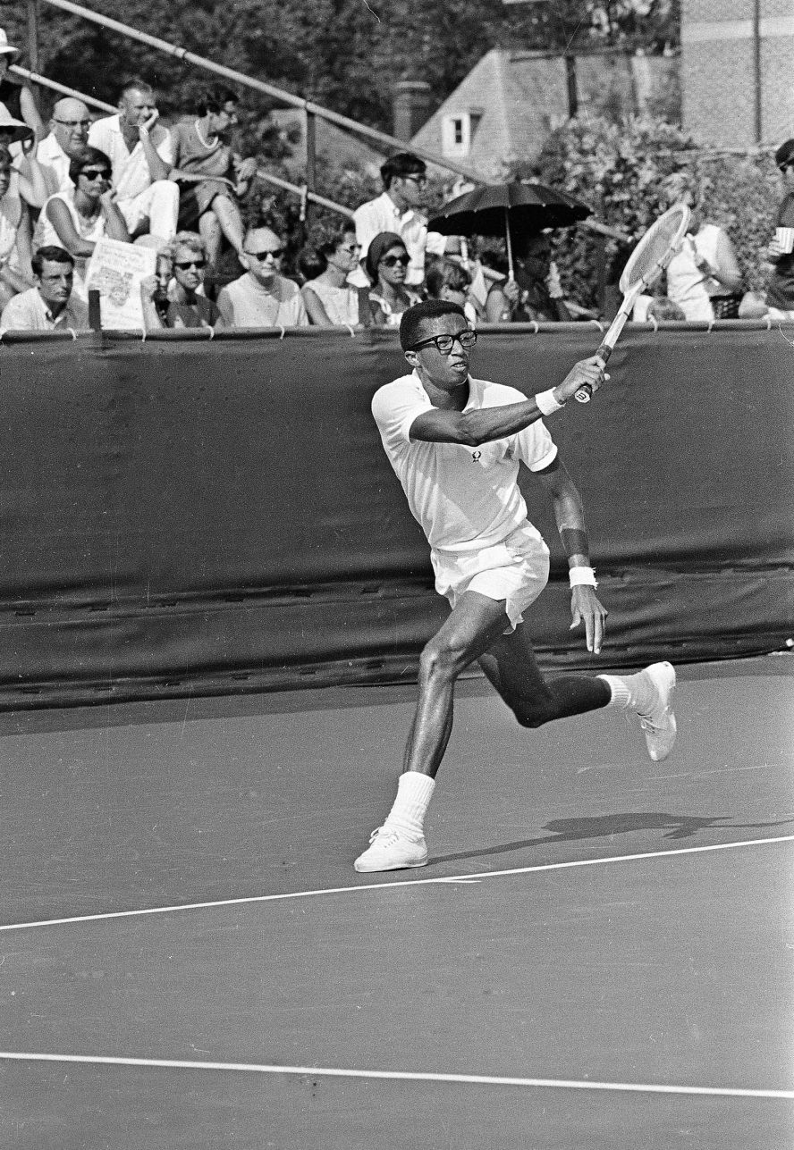 Ashe returns a shot during a Davis Cup match in Cleveland in 1968. The United States won the competition that year.