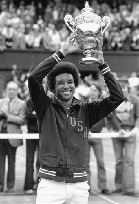 Ashe holds the Wimbledon trophy after his upset win over Jimmy Connors in the 1975 final. That year, he also became the world's top-ranked tennis player.