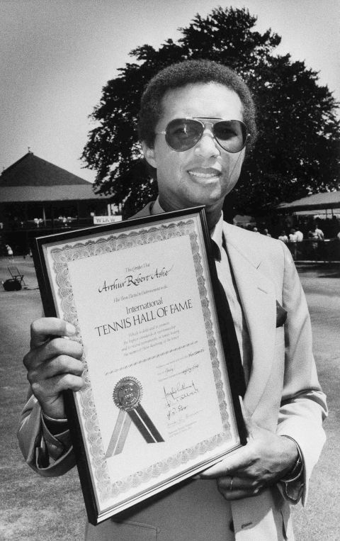 Ashe holds a certificate commemorating his entry into the Tennis Hall of Fame in 1985. The world was shocked in 1979 when the super-fit Ashe suffered a heart attack and underwent a bypass operation. He was set to return to the tennis tour when further complications arose and he was forced to announce his retirement.
