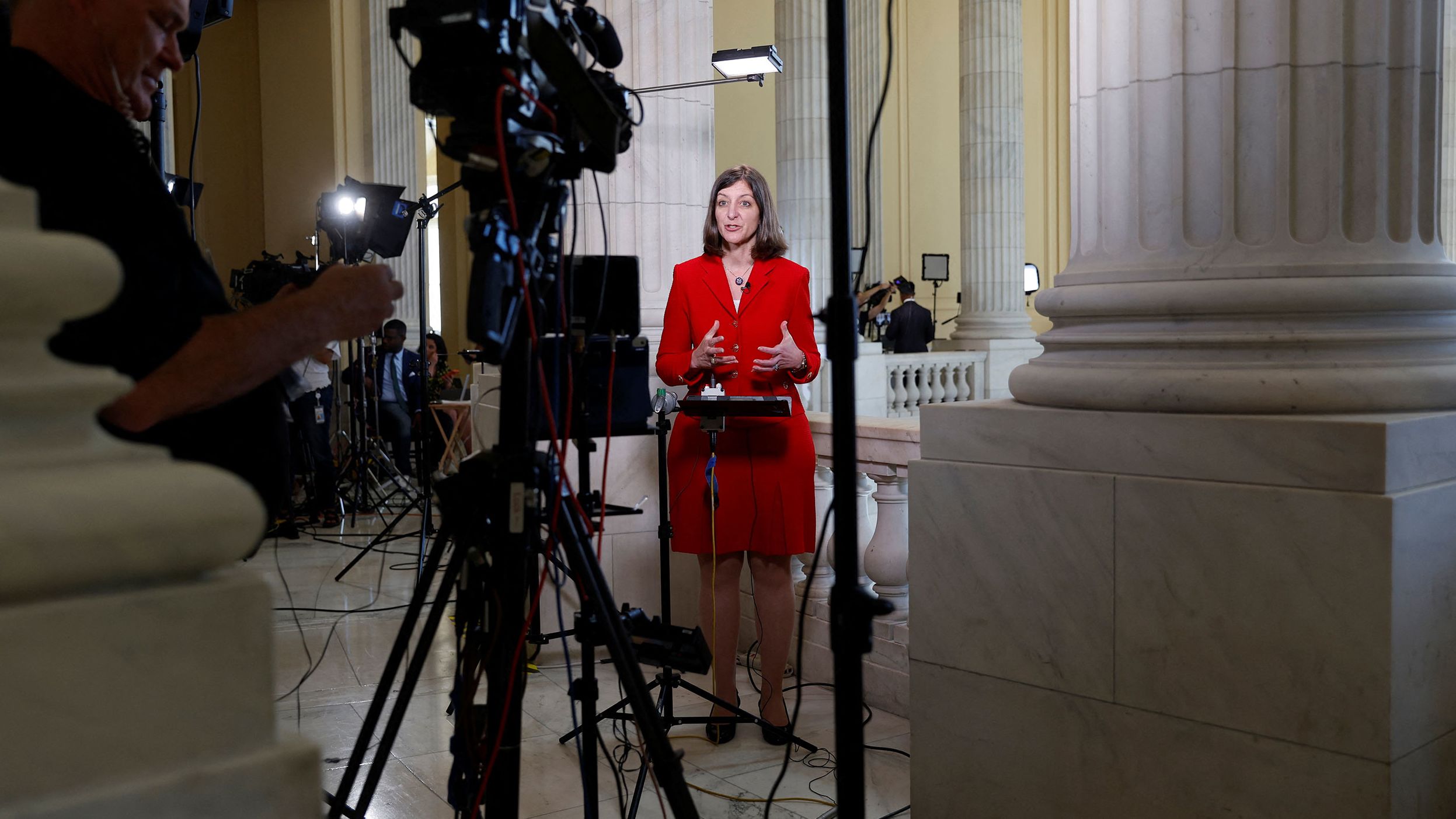 Luria gives a television interview outside the hearing room before the start of proceedings on June 9.