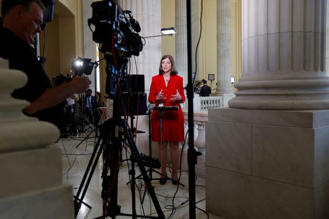 Luria gives a television interview outside the hearing room before the start of proceedings on June 9.