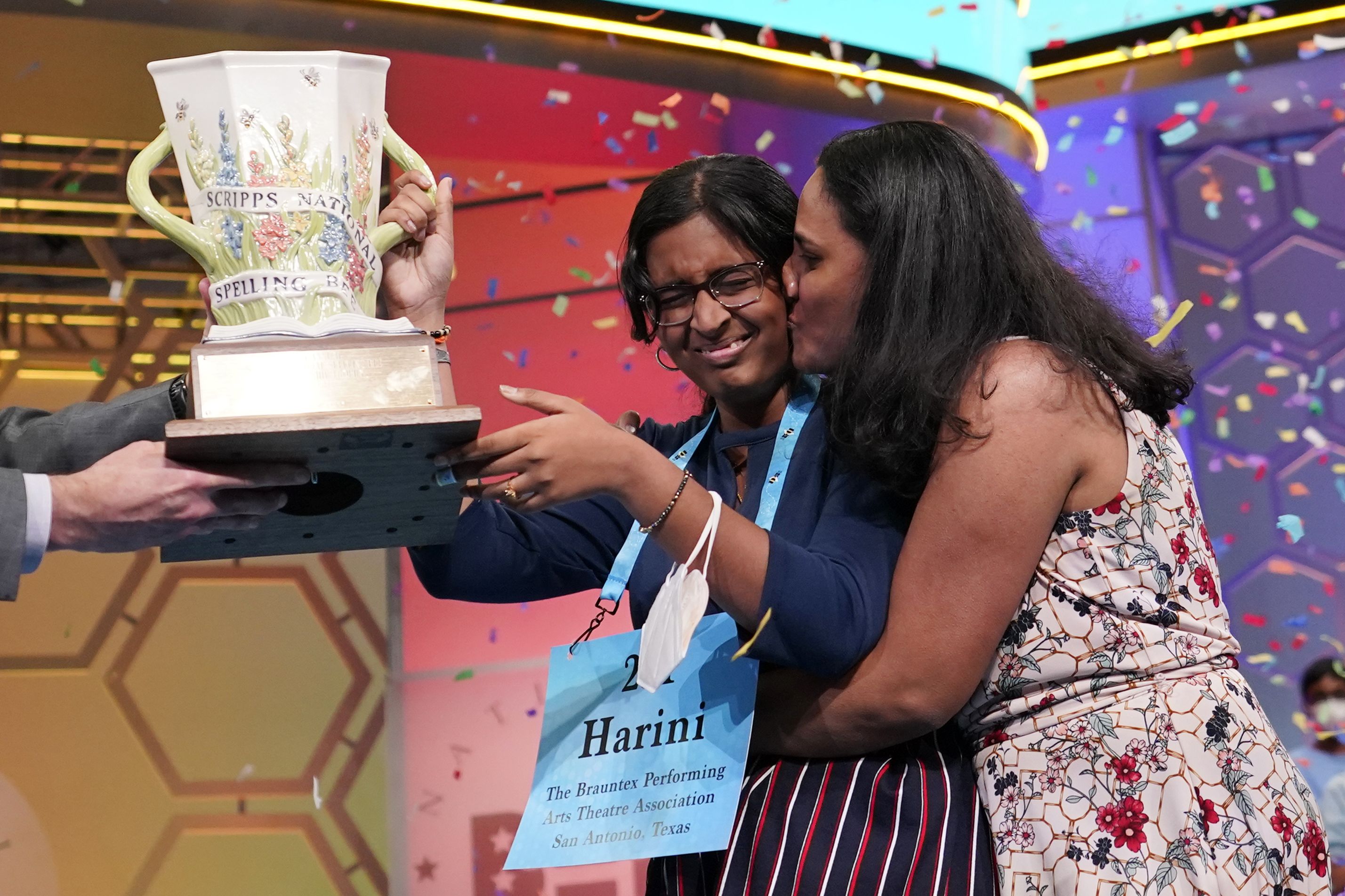 Harini Logan gets a kiss from her mother as she celebrates winning the Scripps National Spelling Bee.