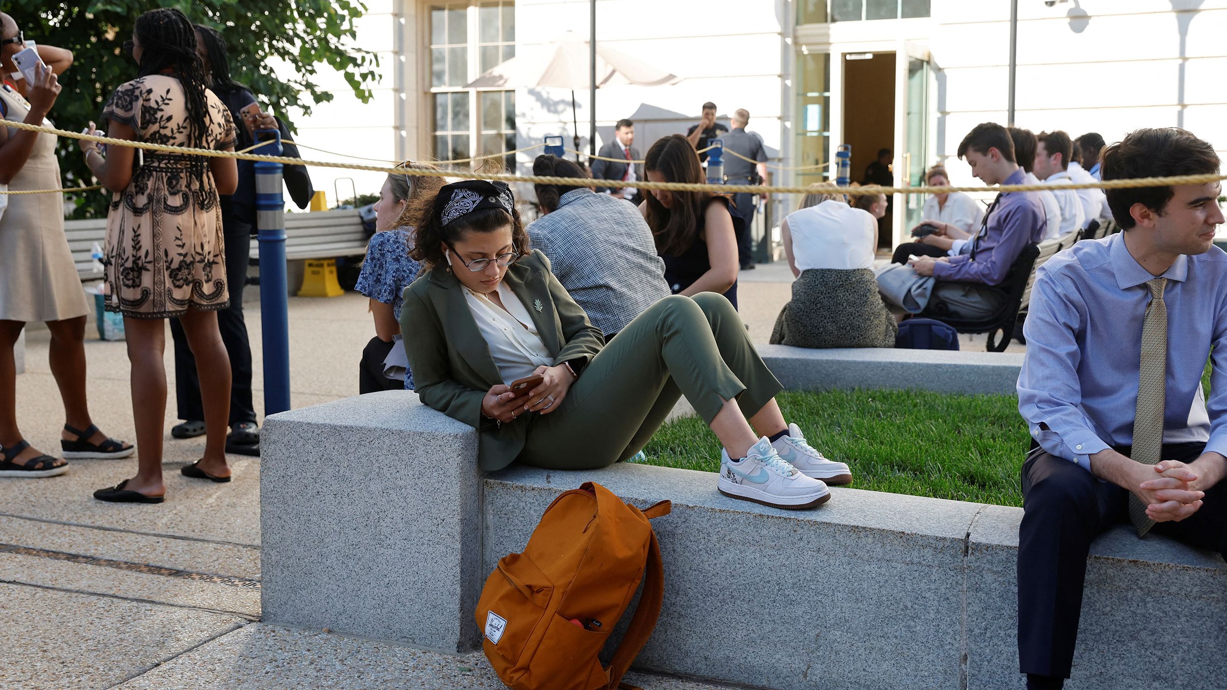 People wait in line to attend the hearing on June 9.