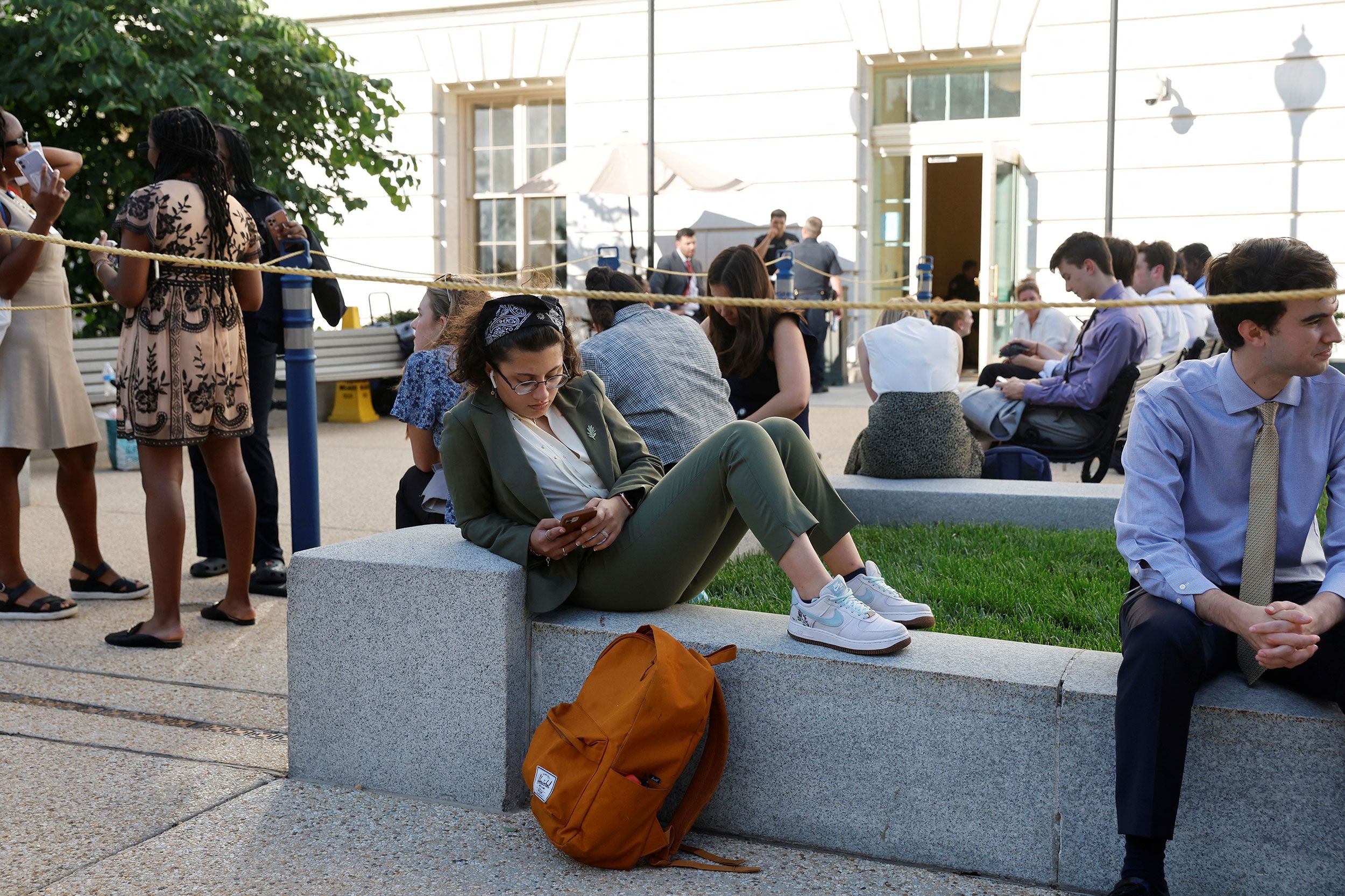 People wait in line to attend the hearing on June 9.