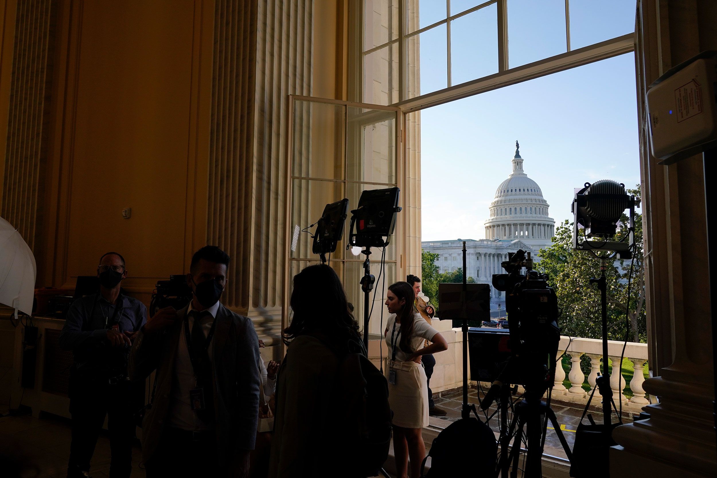 Media members gather on Capitol Hill before the first hearing.