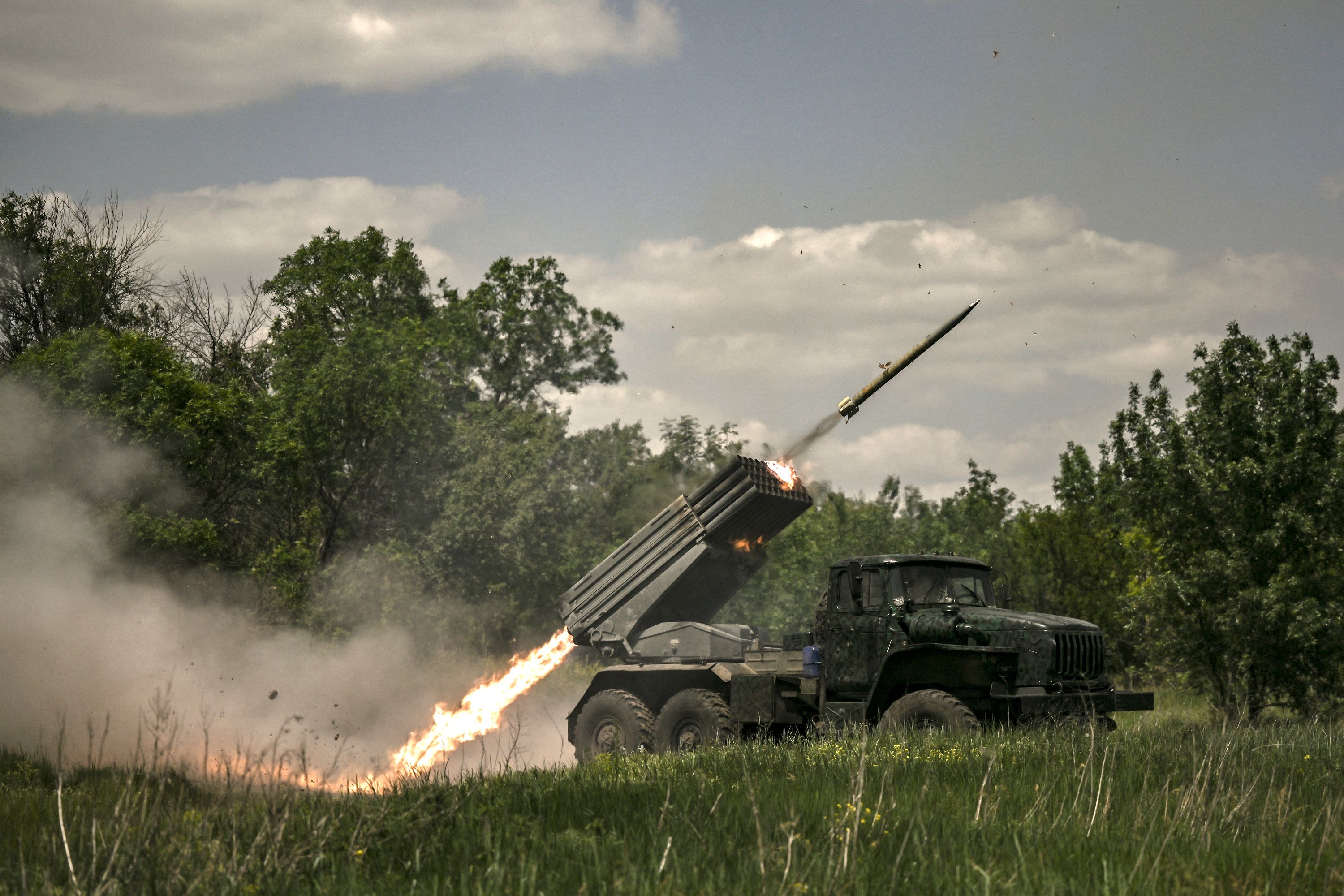 Ukrainian troops fire surface-to-surface rockets toward Russian positions in Donbas.