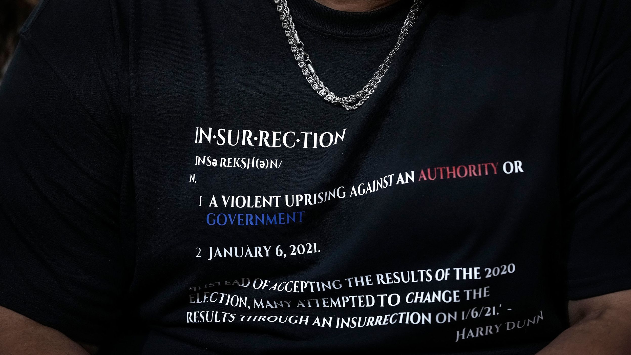 Dunn's shirt carried the definition of insurrection.